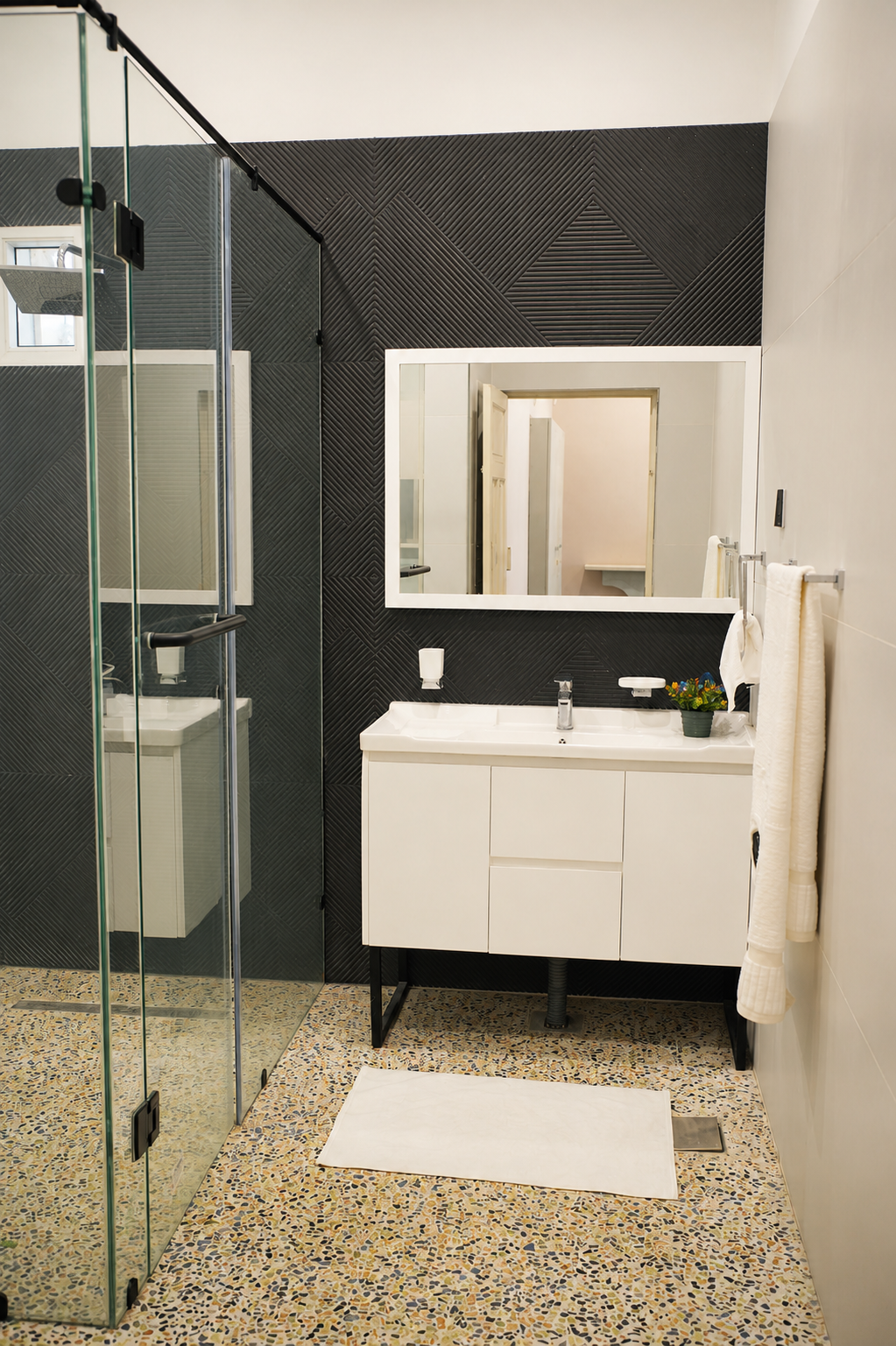Modern en-suite bathroom with glass shower